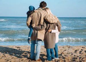 Grieving Family by the Shore