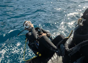 commercial diver underwater in full gear